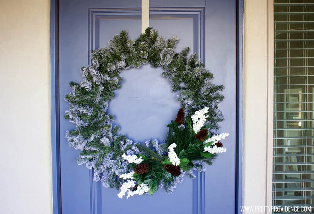 I am loving the color scheme of this beautiful Christmas front porch!