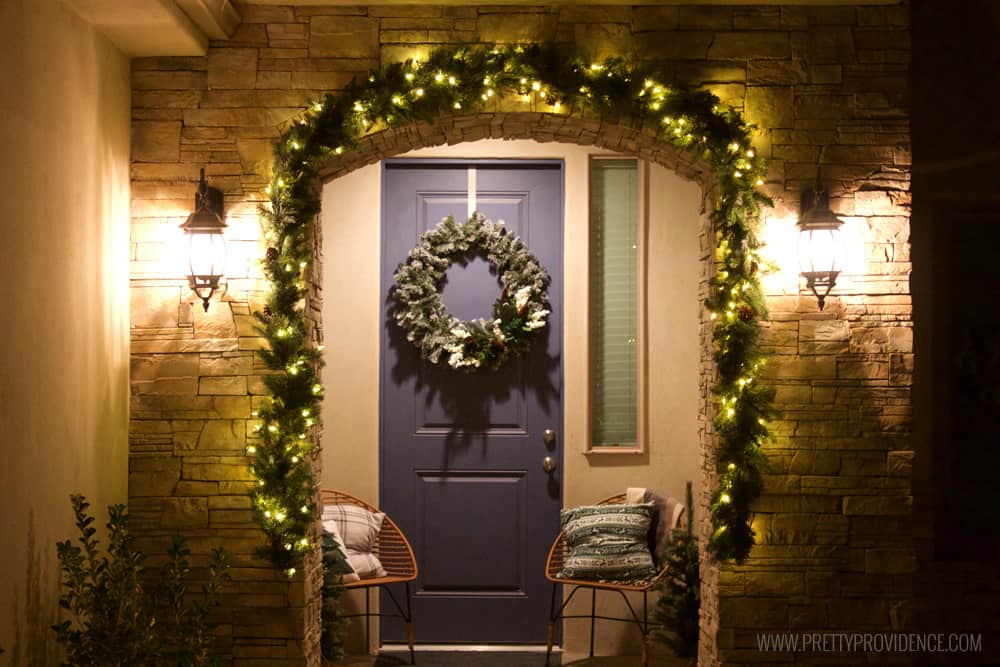 I am loving the color scheme of this beautiful Christmas front porch!