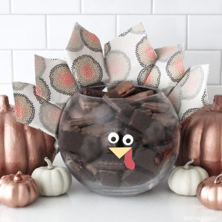 Thanksgiving Centerpiece - Glass bowl made to look like a Turkey with napkins for feathers and a face.