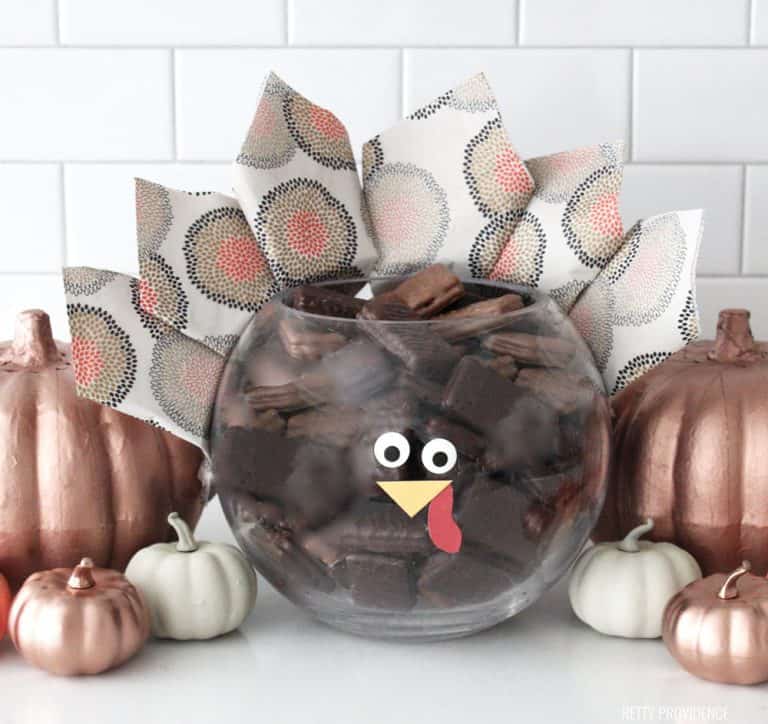 Thanksgiving Centerpiece - Glass bowl made to look like a Turkey with napkins for feathers and a face.
