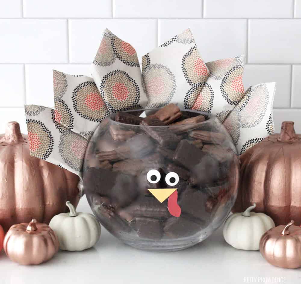 Thanksgiving Centerpiece - Glass bowl made to look like a Turkey with napkins for feathers and a face.