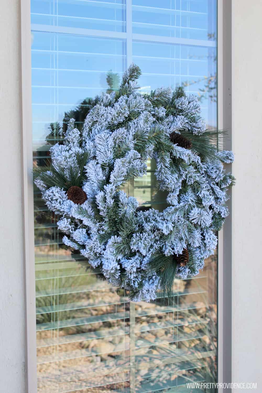 I am loving the color scheme of this beautiful Christmas front porch!