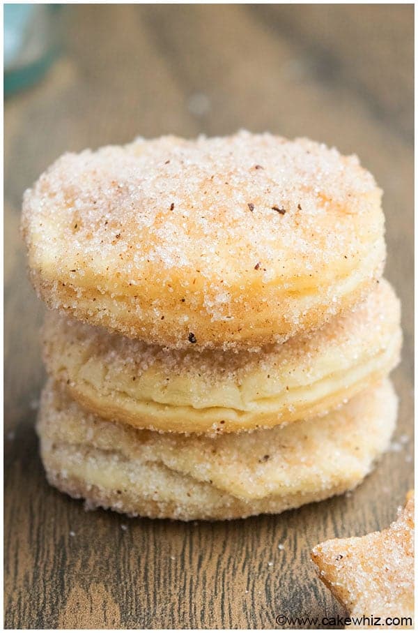 churro cookies covered in cinnamon sugar stacked on top of each other