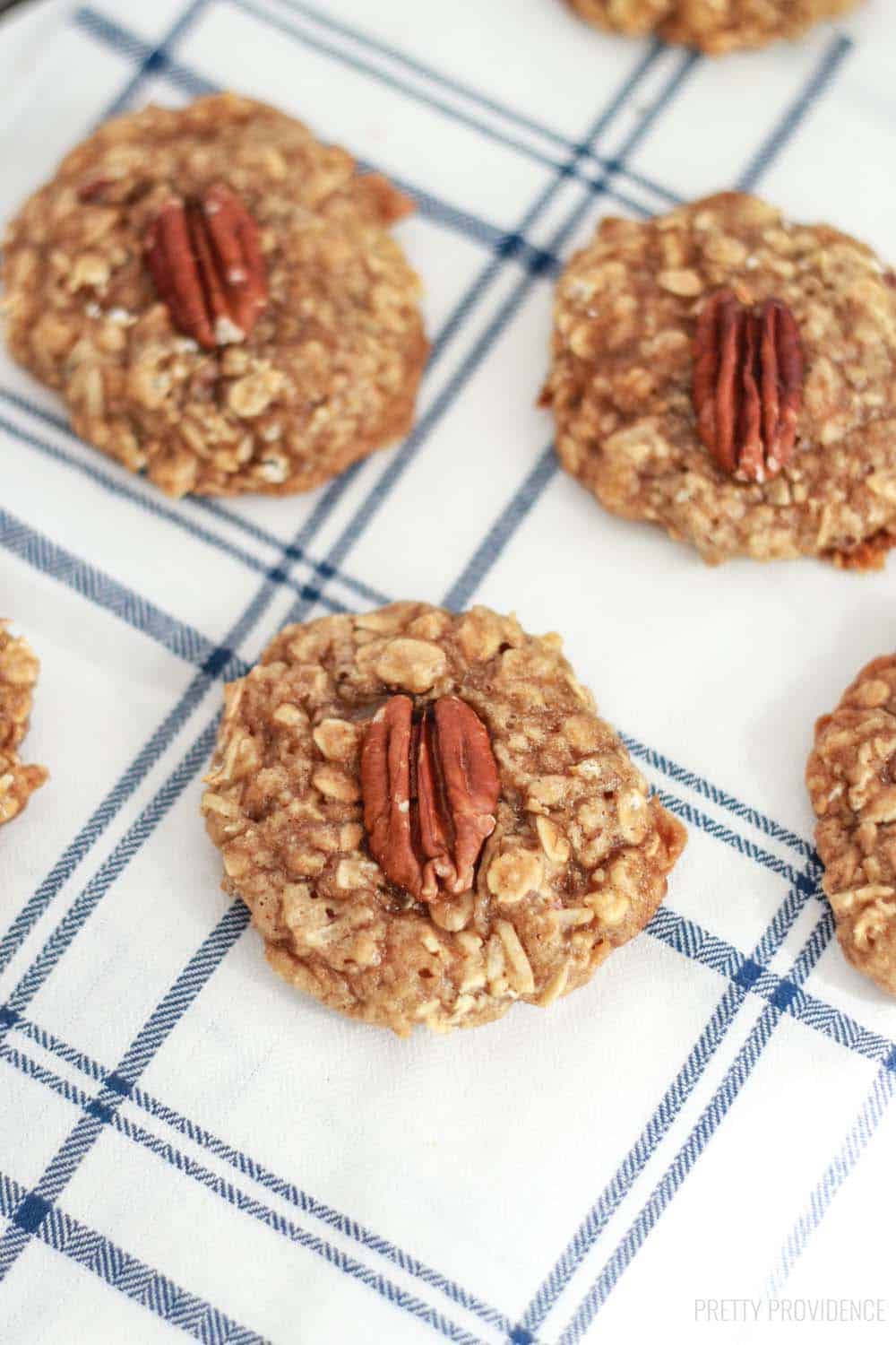 Maple oatmeal cookies with pecans in the middle of each one.