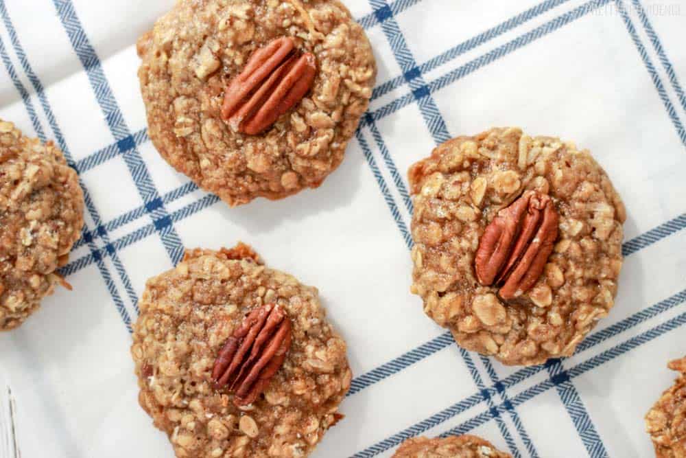 Maple Pecan Oatmeal Cookies on a white and blue tea towel.