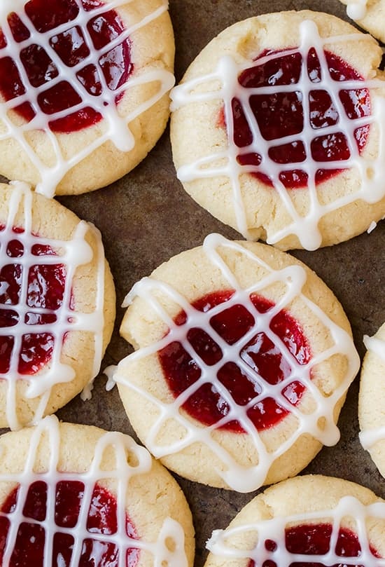 Shortbread thumbprint cookies with raspberry filling and white glaze