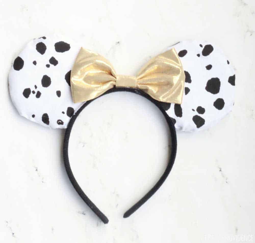 Dalmatian fabric minnie mouse ears with a gold bow