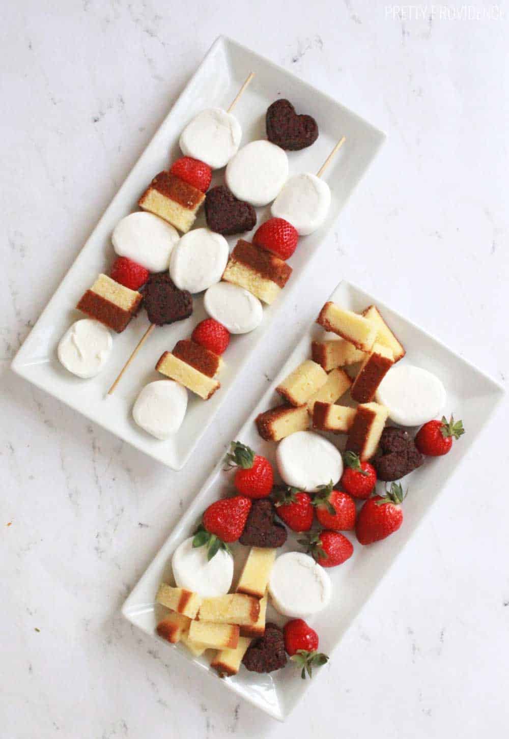 Fancy fondue dippers for Valentine's Day or anniversary desserts! Heart shaped brownies, marshmallows and strawberries are perfect for chocolate fondue!