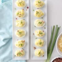 If you like deviled eggs you will LOVE these bacon and cheese deviled eggs! They disappear in a blink everywhere I bring them!