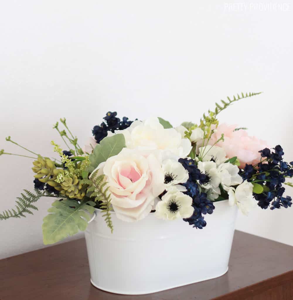 Navy, pink peonies and succulents arrangement for a wedding or spring table!