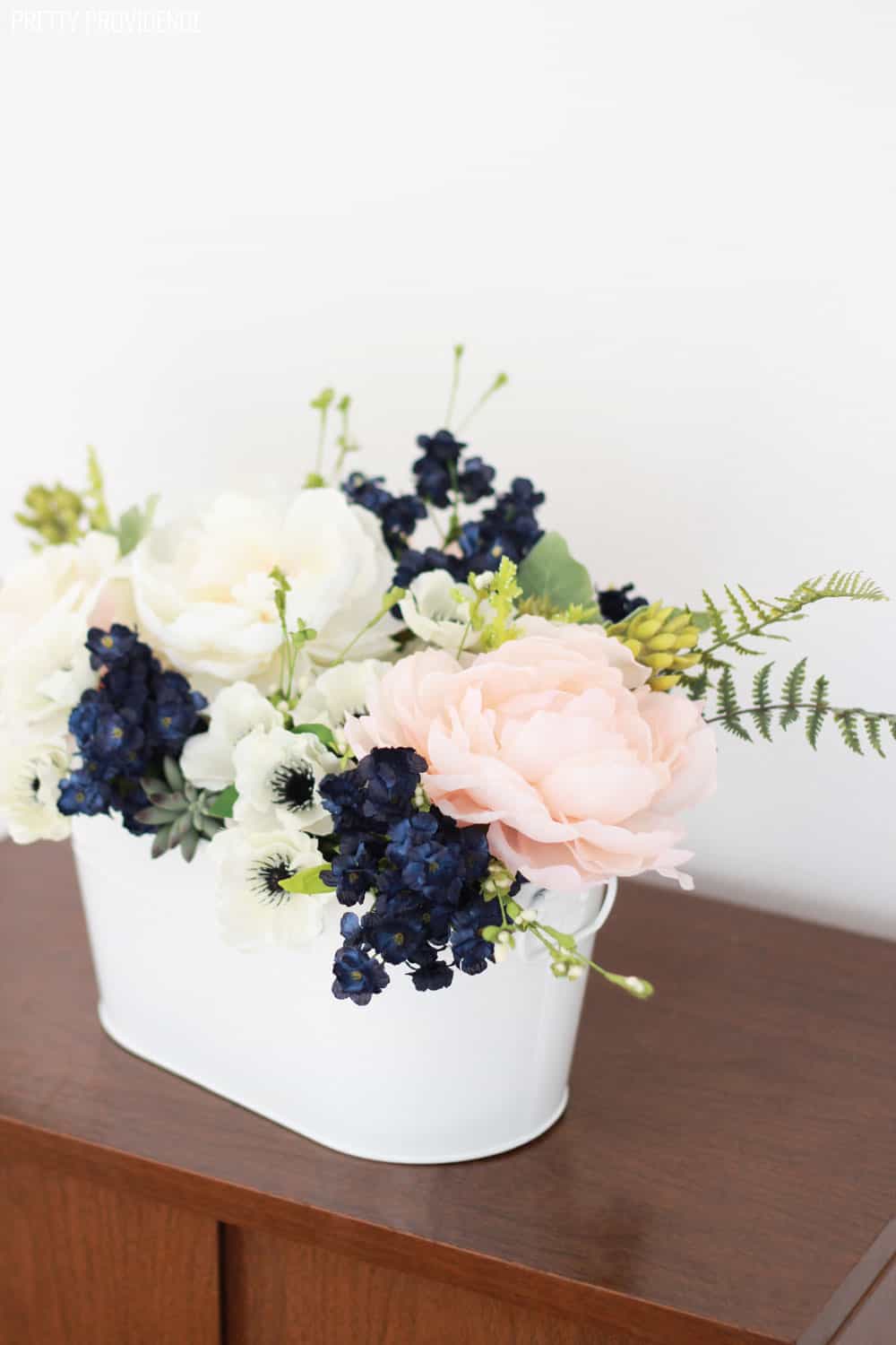 Navy, pink peonies and succulents arrangement for a wedding or spring table!