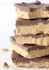 These Reese's peanut butter bars taste just like the Reese's Eggs, only bigger and better! Your whole family will love this easy no bake treat!