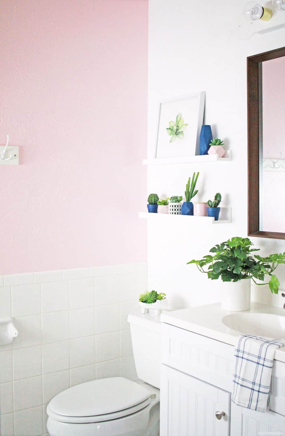 This small bathroom needed a makeover so badly! Now it's a beautiful blush pink bathroom for little girls.