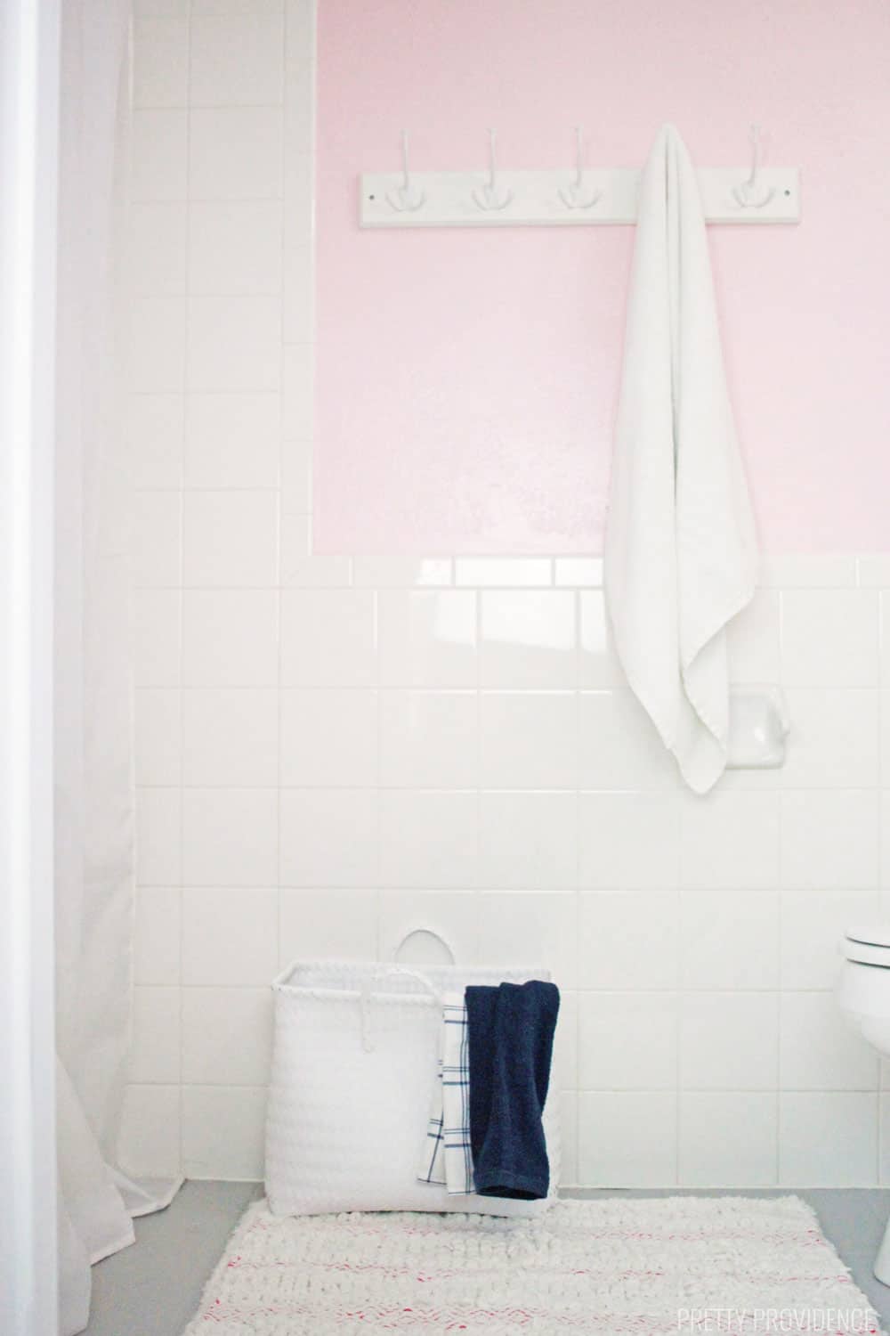 Blush pink bathroom and gray floor.