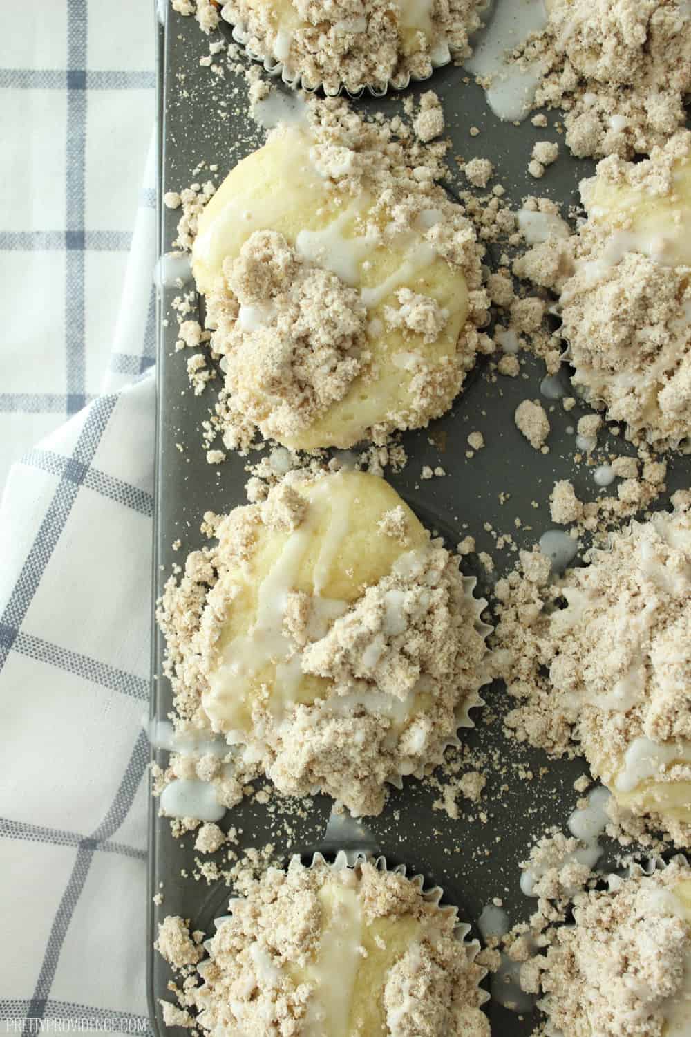 These coffee cake muffins are unbelievably good! From the moist cake base, to the delicious streusel topping to the sweet glaze finish these muffins are sure to hit the spot! 