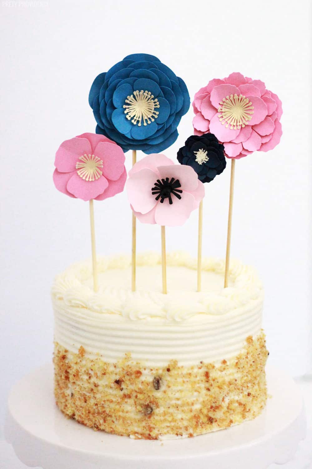 How to make an easy cake topper with paper flowers made of cardstock! This is an awesome, easy cake decorating idea!
