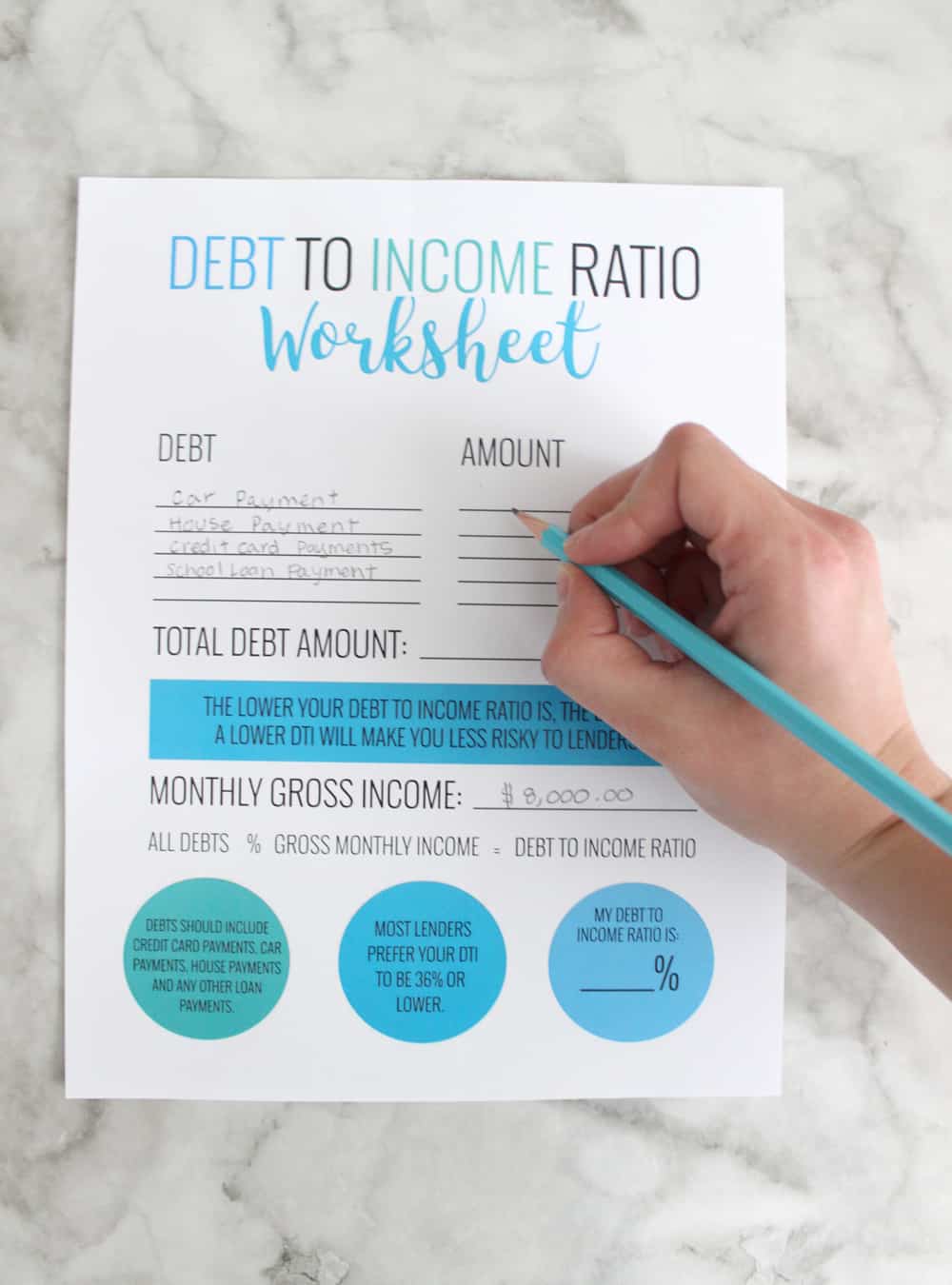 A person filling out their debt to income worksheet in order to determine DTI. 