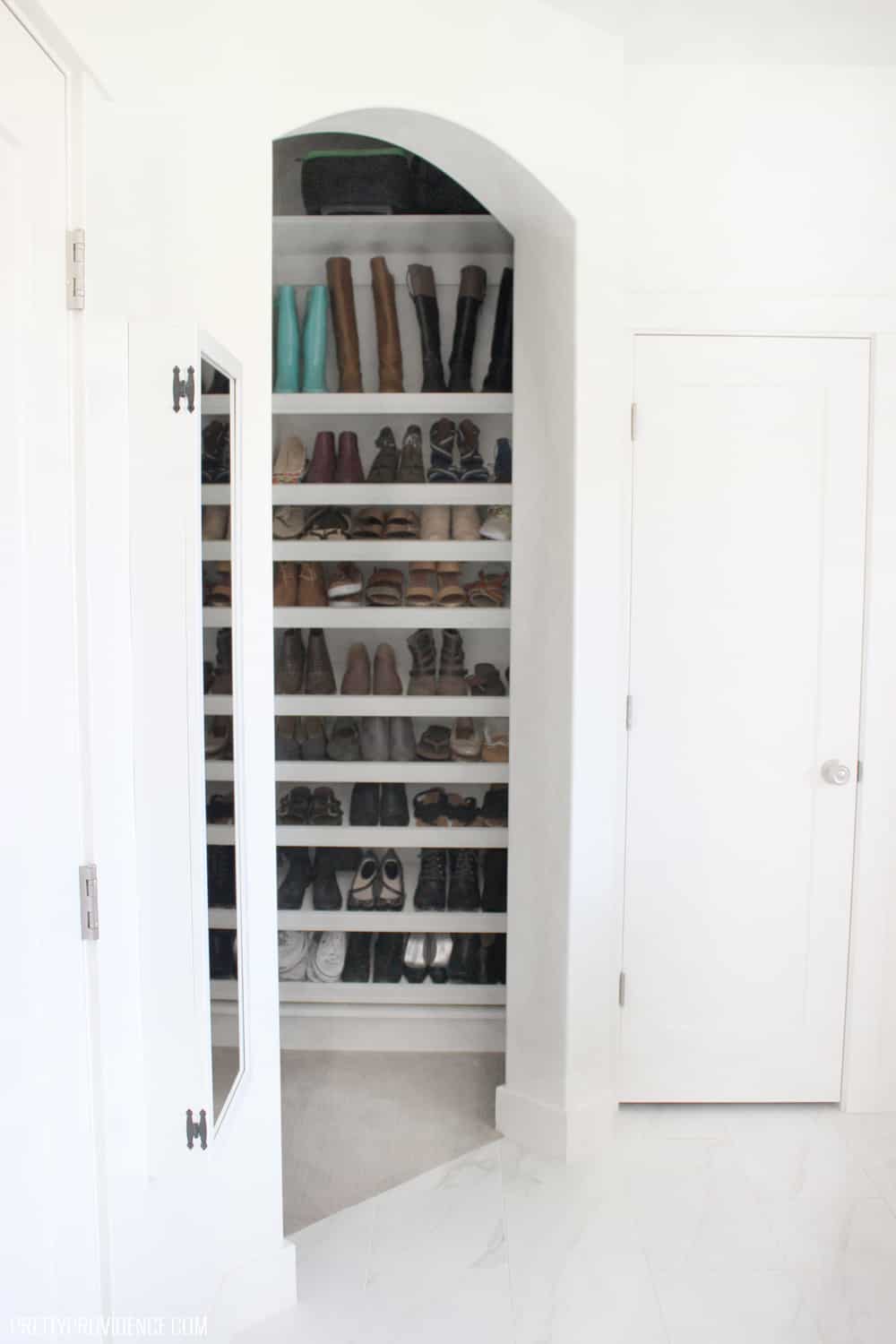 The entry way to the master closet. Looking in on the master closet shoe racks from the bathroom. 