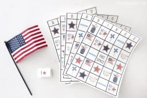 4th of July bingo cards spread across a white countertop.
