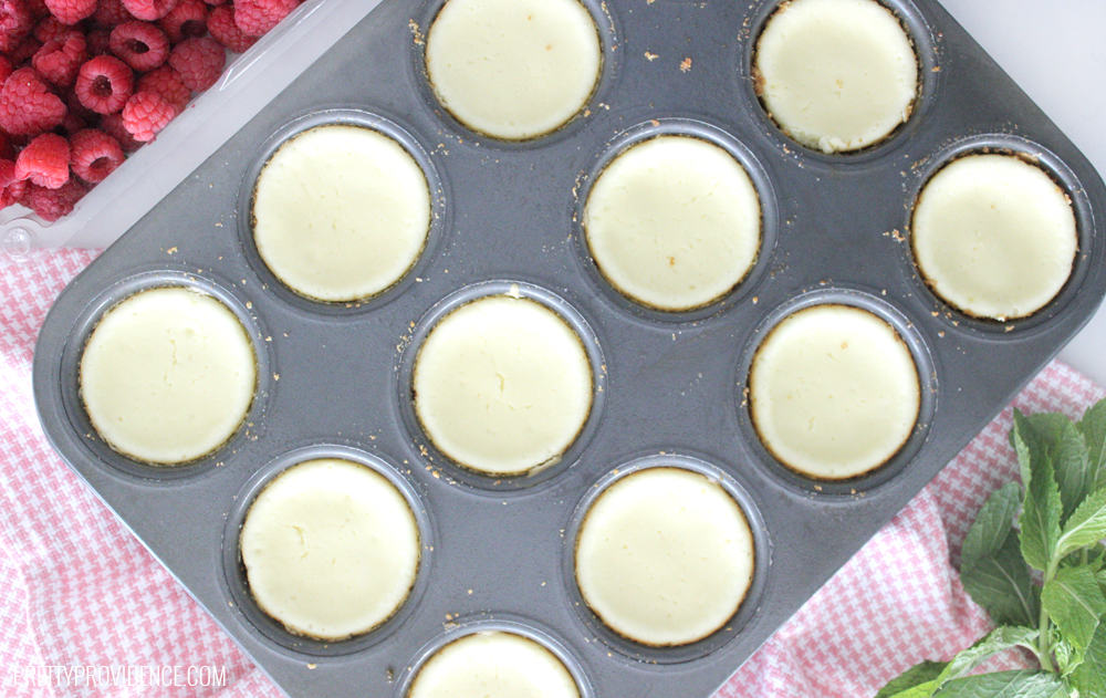 Mini cheesecakes in muffin tray. 