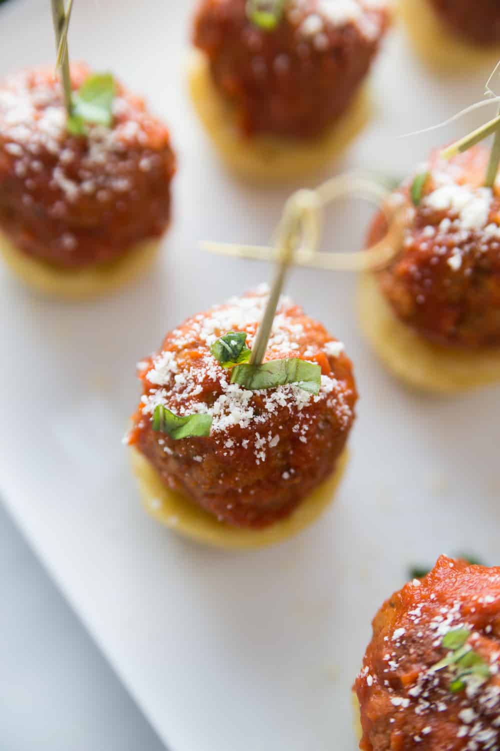 birds eye view of an Italian meatball appetizer with a stick