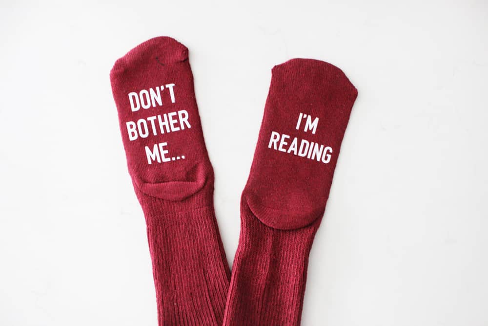 "Don't bother me, I'm reading" funny socks