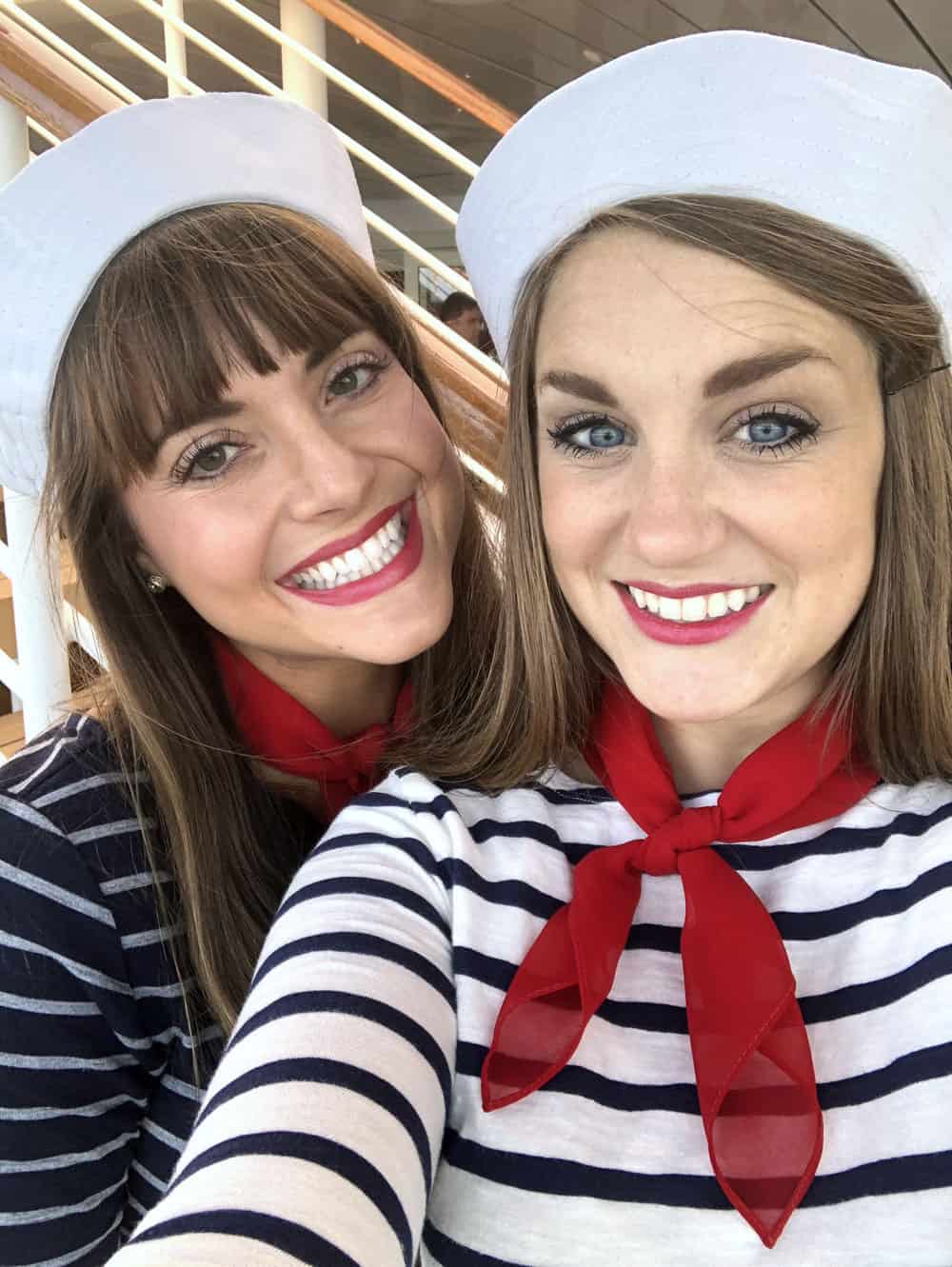 two girls in sailor costumes up close