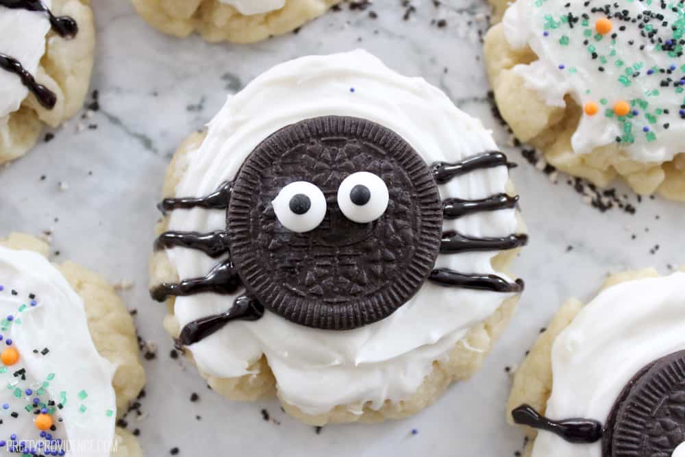 sugar cookie with oreo spider on top on a granite counter