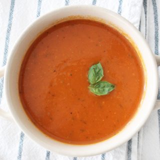 Hearty and delicious dairy free tomato soup! Not only is this soup super healthy, but it is so dang good! Your kids will never know it's packed full of veggies!