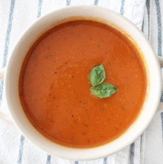 Hearty and delicious dairy free tomato soup! Not only is this soup super healthy, but it is so dang good! Your kids will never know it's packed full of veggies!