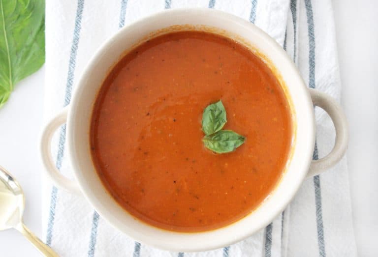Hearty and delicious dairy free tomato soup! Not only is this soup super healthy, but it is so dang good! Your kids will never know it's packed full of veggies!