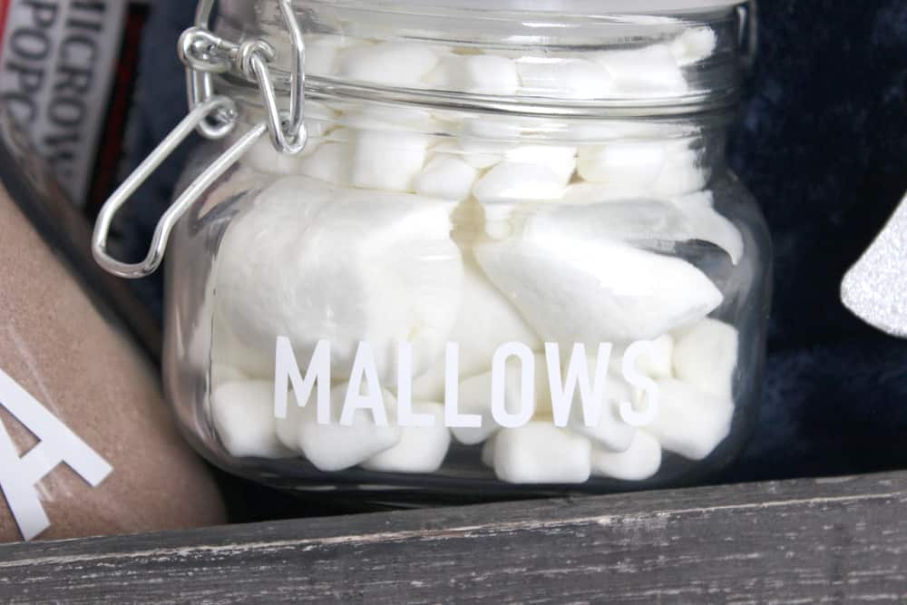 Jar of marshmallows in night in gift basket. 