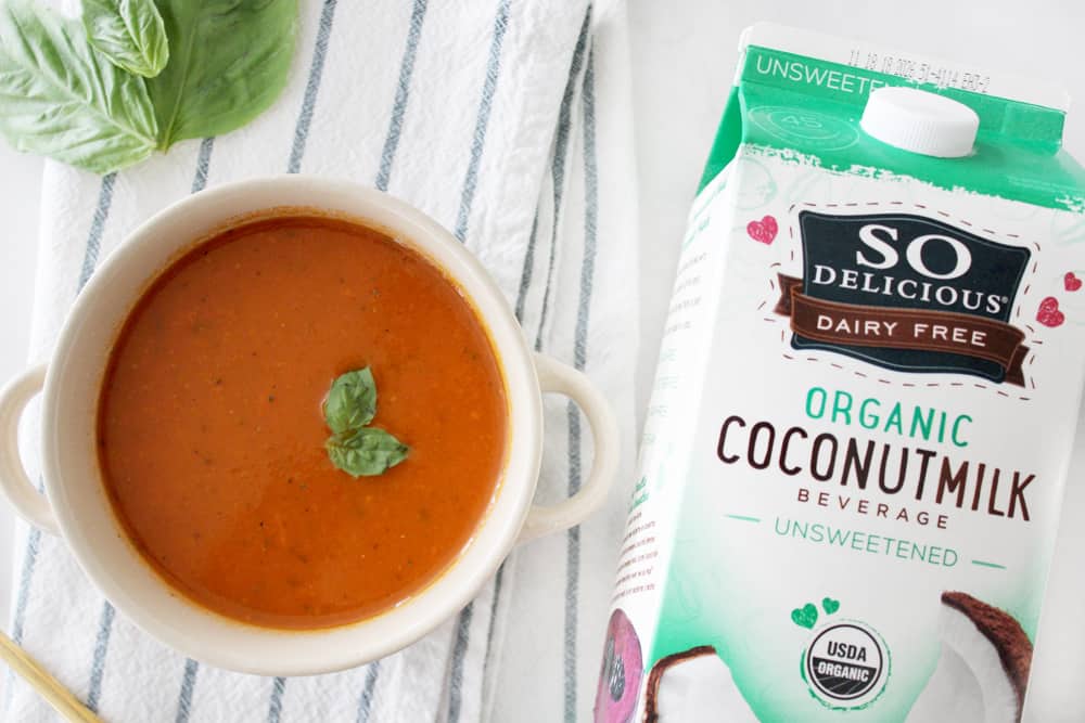 Hearty and delicious dairy free tomato soup! Not only is this soup super healthy, but it is so dang good! Your kids will never know it's packed full of veggies! 