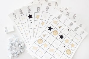Several New Years Eve Bingo cards spread out in a fan shape.