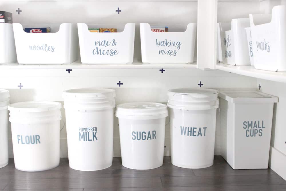 labeled five gallon jars in pantry