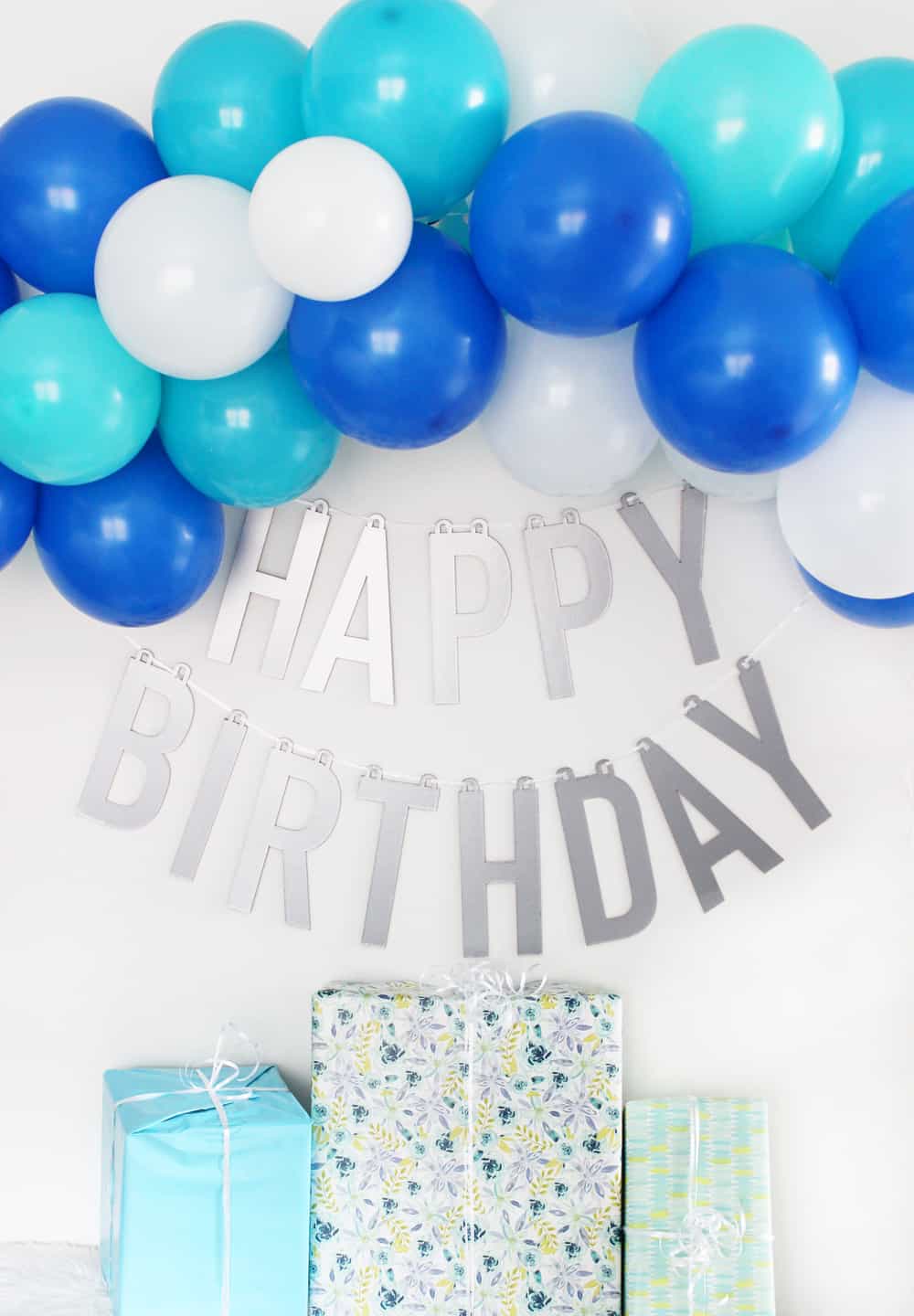 If you want a happy birthday banner that you can use over and over again you will love this happy birthday banner DIY made using the Cricut knife blade and chipboard! I can't wait to use this for all my kids birthdays for years to come. 