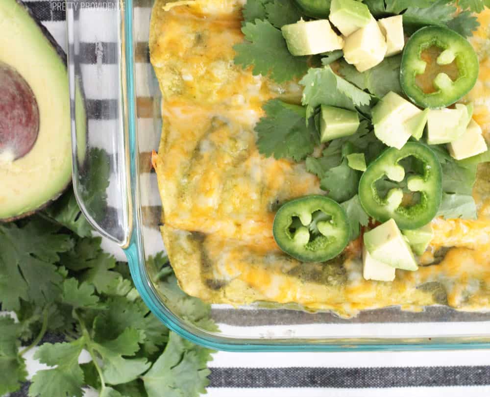 Ground beef enchiladas topped with melted cheese, jalapeño peppers, cilantro and diced avocado.