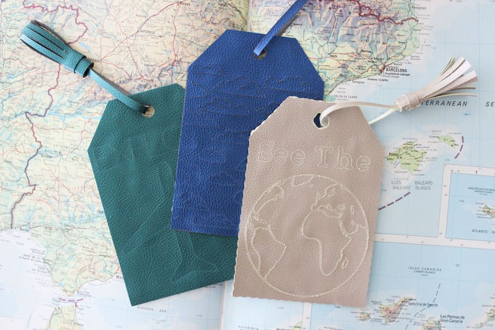 diy luggage tags on top of an open atlas