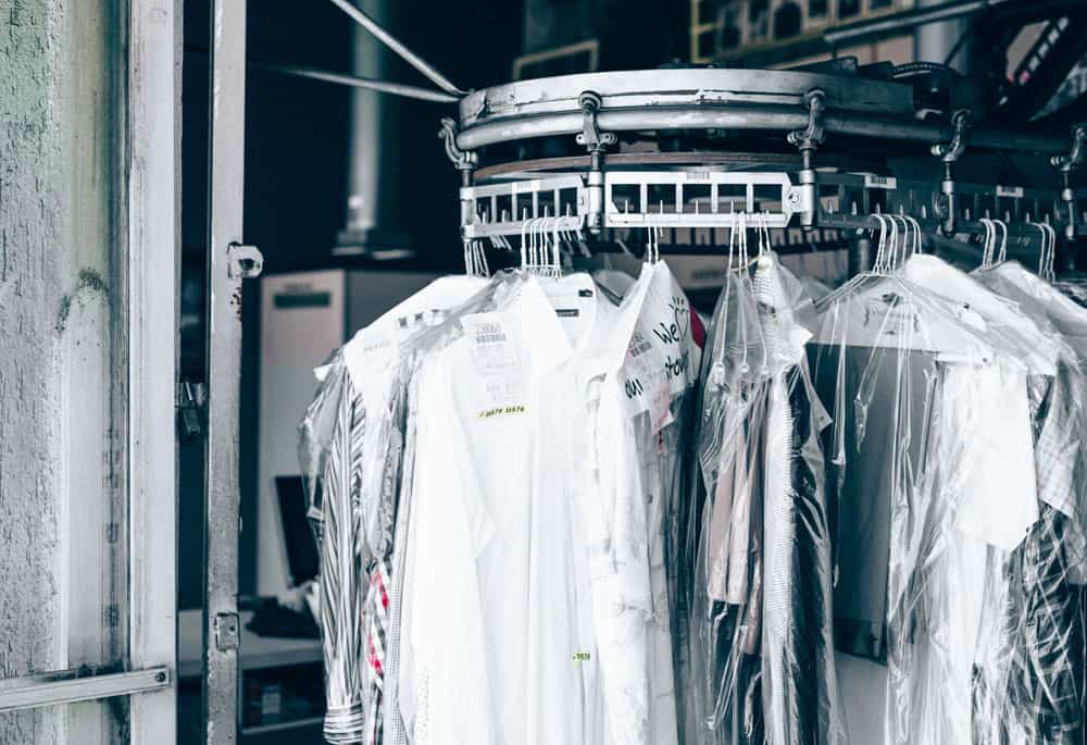 dry cleaning hanging on a rack