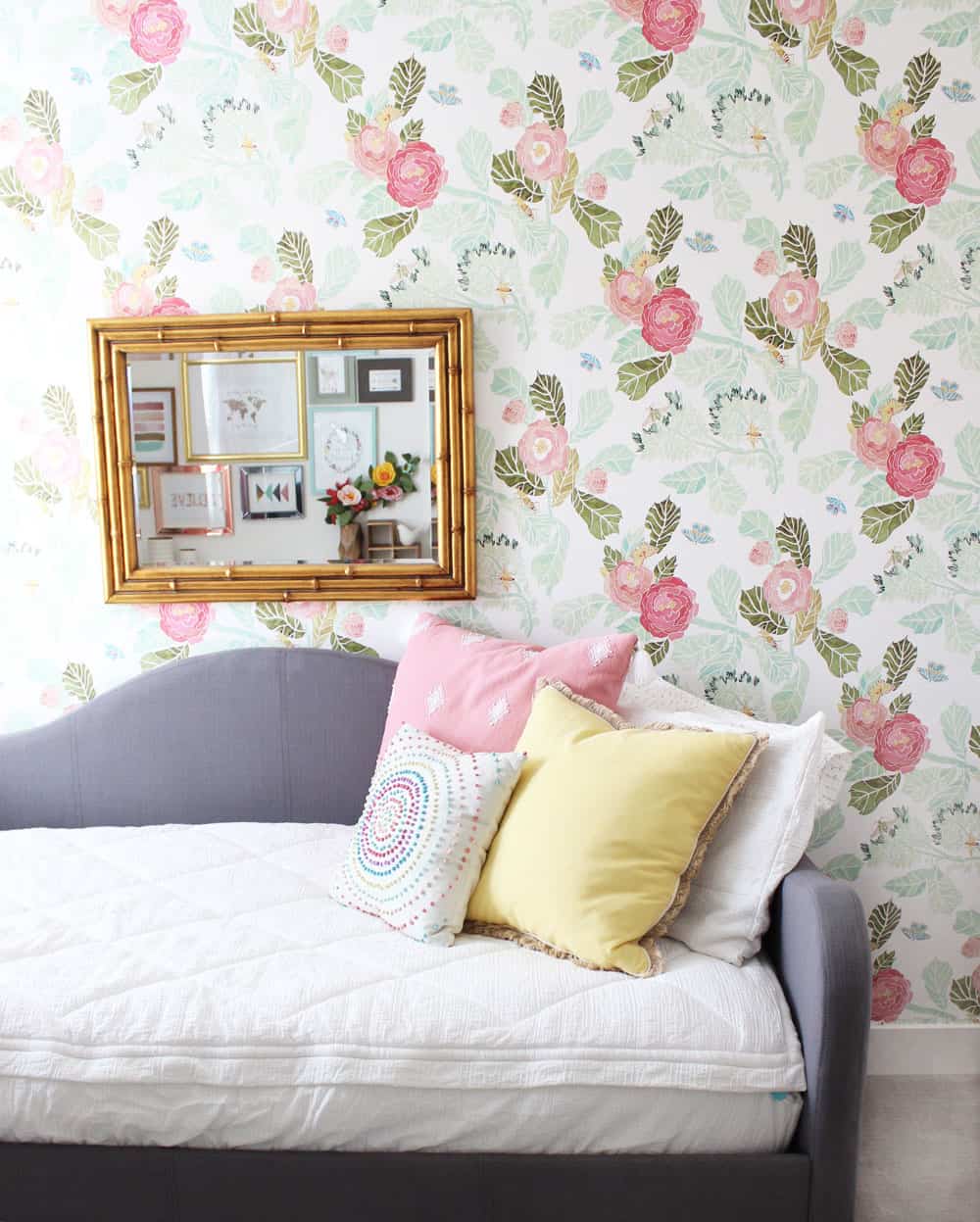 floral wallpaper with a gold mirror