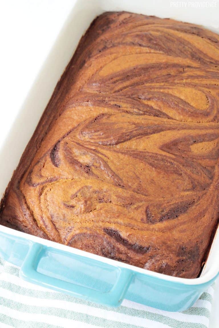 Pumpkin Swirl Brownies baked to perfection in a blue baking dish.