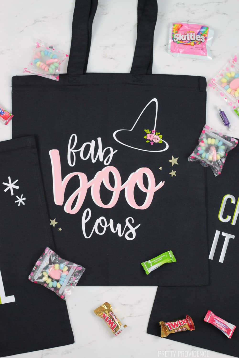 DIY Trick or Treat Bags made with plain black tote bags and Cricut iron-on