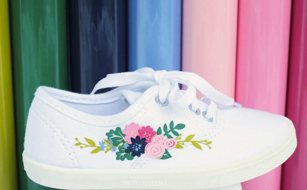 White shoe with floral design on the side, tutorial for how to Iron on to shoes.