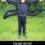 toddler spider costume against a green foresty background