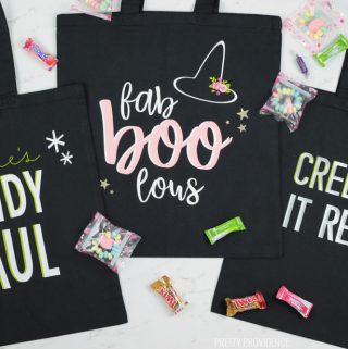 Three black Halloween Trick or Treat Bags with 'Candy Haul' 'Fab Boo Lous' and Creepin' it real' phrases on them.