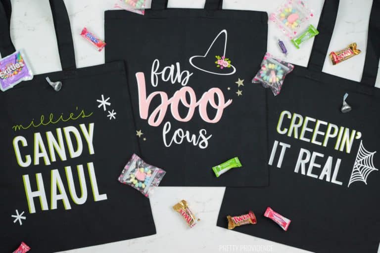 Three black Halloween Trick or Treat Bags with 'Candy Haul' 'Fab Boo Lous' and Creepin' it real' phrases on them.
