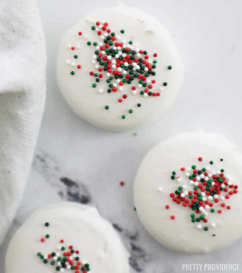 White chocolate covered oreos with Christmas sprinkles