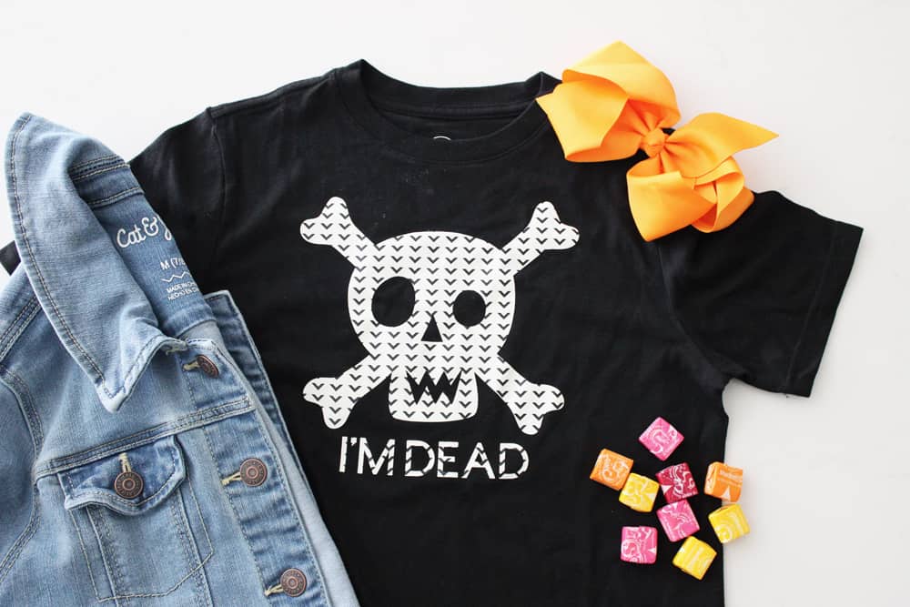 black shirt with skeleton crossbones and the words i'm dead