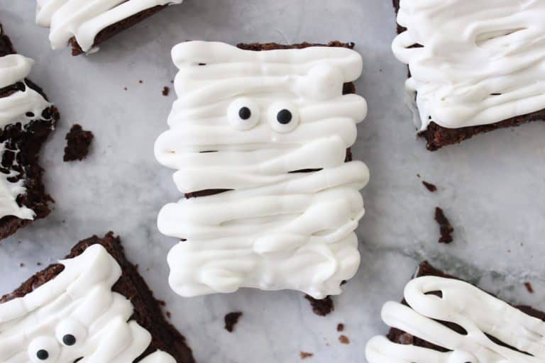 mummy brownie with candy eyeballs on a granite countertop