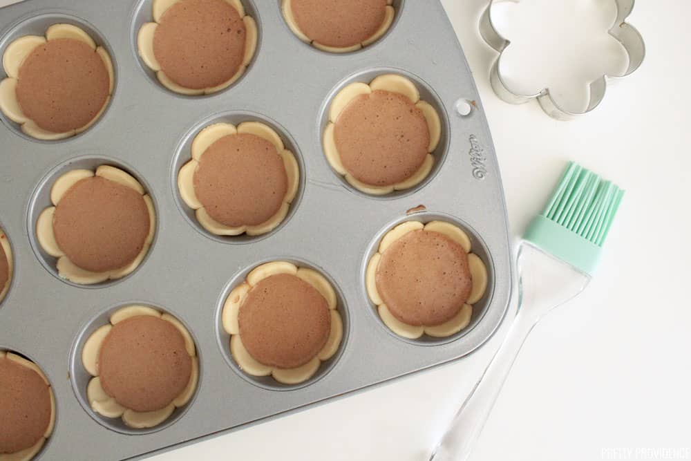 Scalloped mini pies in a muffin tin.